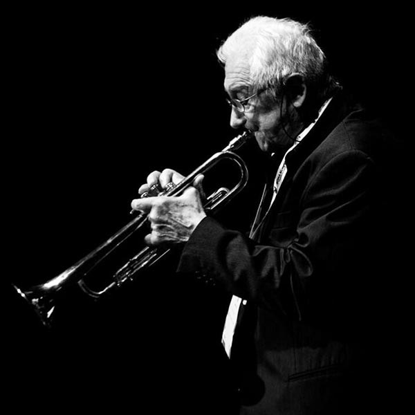 A photo of Cicci Santucci playing the trumpet