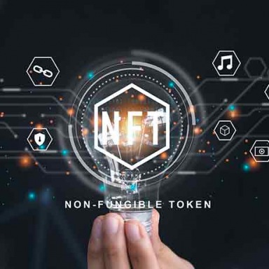 A hand is holding a virtual NFY token
